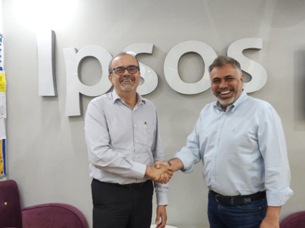 Amit Adarkar shaking hands with Sameer Grover soon after announcing acquisition of Crownit